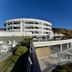 Park Hotel Mirabeau in Gasperina with curved terrace, outdoor seating, and hillside views
