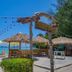 Pp Nice Beach Resort in Ko Phi Phi beachside seating with thatched huts and ocean view