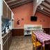 Hosteria Ailen in Ushuaia dining room with tables, chairs and vaulted wood-beam ceiling