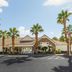 Residence Inn by Marriott Las Vegas Stadium Area exterior with palm trees and entrance