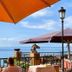 Sea-view terrace at Rigat Park & Spa Hotel in Lloret de Mar with umbrellas and ocean horizon