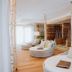 Hotel Lärchenhof in Rennweg am Katschberg: bright spa lounge with round daybeds and wooden decor