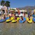 Pension Ageliki, Platis Gialos: kayaks lined up on a shallow beach with guests and mountain backdrop