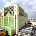 Millennium Hotel Sirih Jakarta exterior with ornate green facade and city skyline view in Jakarta