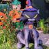 Ann Arbor Bed and Breakfast Halloween garden display with inflatable cat, pumpkin, and scarecrow