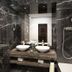 Khalidia Palace Hotel Dubai bathroom with double vessel sinks, marble walls and a handheld shower