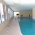 Indoor pool at Royal Palms by Wyndham Vacation Rentals in Gulf Shores with lounge chairs and seating