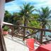 Pousada Mar de Araçatiba in Vila do Abraao, tropical balcony with wooden railing and ocean view