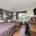 Super 8 by Wyndham Zanesville guest room with two beds, desk, TV and window view