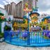 Hakka park International Hotel in Meizhou with colorful outdoor water play area and high-rise towers