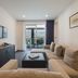 Avala Resort & Villas, Budva: modern suite with sofa, TV, and balcony sea view