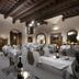 Villa Casagrande Resort E Spa in Figline Valdarno dining room with set tables and wooden beams