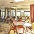 Novotel Paris Créteil Le Lac in Créteil with a bright dining room, round tables, and woven chairs