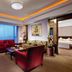 Yidu Jinling Grand Hotel Yancheng suite with red sofas, living area and bedroom view
