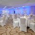 Hilton Washington DC/Rockville Executive Meeting Center ballroom with round tables and white chair covers in Rockville