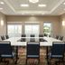 Hilton Garden Inn Riverhead meeting room with U-shaped conference table and chairs