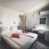 Gartenstadt Hotel, Ludwigshafen am Rhein: twin bed hotel room with desk, sofa, and modern lighting