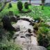 Hotel Fraga do Eume in Capela features a landscaped garden with stone path and small pond