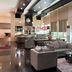Grand Daira Hotel Palembang lounge with sofas, round table, and large windows in Palembang