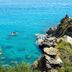 Park Hotel Mirabeau in Gasperina with a clear turquoise sea view from rocky cliffs