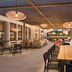 Hilton Motif Seattle rooftop terrace with long dining table and city skyline views