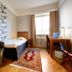 First Hotel City Eskilstuna single room with bed, desk, chair and window in Eskilstuna