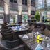 Parkyard Hotel Jiaxing in Jiaxing outdoor dining terrace with wicker tables, umbrellas and glass railing