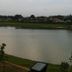 City Star Hotel Kulai in Kulai overlooks a calm lake with grassy banks and trees