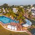 Golden Tulip Dar Es Salaam seaside pool with ocean views, palm trees and lounge chairs