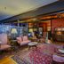 Mendocino Hotel and Garden Suites lounge with vintage seating and patterned rugs in Mendocino