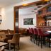 Leonardo Hotel & Residenz München in Munich, lounge with bar counter and seating area