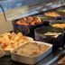 The Railway Inn in Brixham buffet with pastries, fruit, cereal and serving spoons