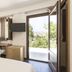 Giardino Sul Duomo in Ragusa room with balcony door, desk, TV and wardrobe