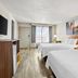 Days Inn by Wyndham Fontana / Rialto guest room with two beds and a window view