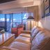 Newpark Resort Park City suite with sofa, dining table and balcony city views
