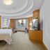 Makati Shangri-La, Manila guest room with city skyline view and curved ceiling