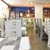 Ginevra Palace Hotel in Rome dining room with white tables and tall chairs