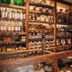 Hotel Boutique Casareyna in Puebla City bar with wine bottles and shelves of spirits