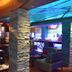 Hotel Royal Qosqo in Cusco bar lounge with red sofa, stone columns and blue-lit ceiling