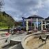 Eco Terme Snovik, Kamnik: outdoor terrace with umbrellas and a small horse statue in front of the hotel