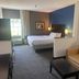 Comfort Inn & Suites Trussville I-59 Exit 141 guest room with bed, sofa, and window seating