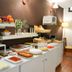 I AM La Posada Hotel and Apartment breakfast buffet with fruit, pastries, and coffee in Benalmádena
