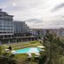 Montebelo Viseu Congress Hotel in Viseu with outdoor pool, lawn, and city views