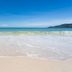 OYO 1134 Baan Zarn Guesthouse in Patong with sandy beach, turquoise sea and distant hills