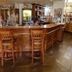 The Railway Inn, Brixham hotel bar with wooden counter and stools in a pub lounge