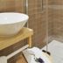 Hotel Restaurant Klosterhof bathroom with vessel sink, wooden vanity, and glass shower in Gutenzell-Hürbel
