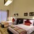 Raf Hotel Apartment in Dubai, two twin beds in a modern guest room with balcony doors and TV