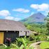 Hotel Lavas Tacotal in La Fortuna with lush tropical gardens and a volcano view