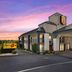 Super 8 by Wyndham Bulls Gap Greeneville Area exterior at sunset in Bulls Gap