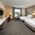 Hilton Garden Inn Toronto/Oakville guest room with two beds, desk and window view in Oakville